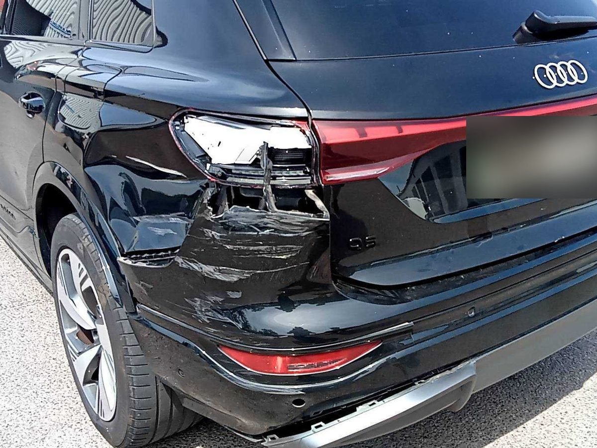 Audi Q6 e-tron with rear quarter, light cluster and bumper damage before repair